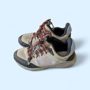 New Balance Beige and Black Sneakers